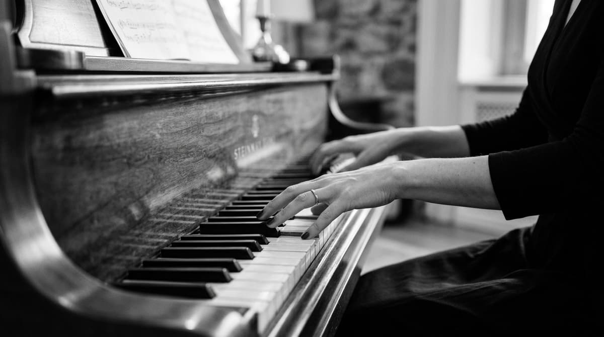 Hands playing piano keys - Harmony Heavens Piano Classes Goregaon Mumbai